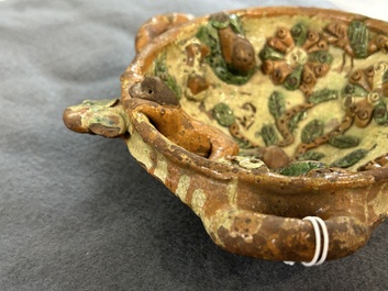 A slip-decorated three-handled earthenware bowl, probably Germany, 16/17th C.