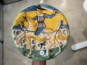 A polychrome Italian maiolica dish with a horserider, Montelupo, 17th C.