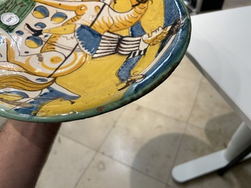 A polychrome Italian maiolica dish with a horserider, Montelupo, 17th C.