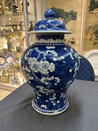 A Chinese blue and white 'prunus on cracked ice' vase and cover, Kangxi