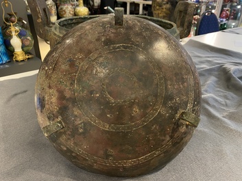 A very large archaic bronze tripod vessel and cover, 'ding', Eastern Zhou period