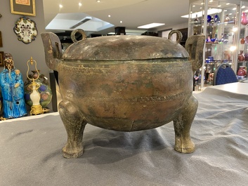 A very large archaic bronze tripod vessel and cover, 'ding', Eastern Zhou period