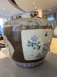 A large Chinese famille rose fish bowl on wooden stand, 19th C.