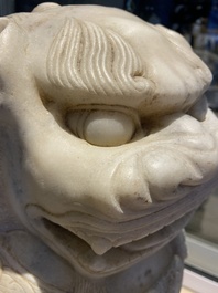 A pair of large Chinese white marble Buddhist lions, 19th C.