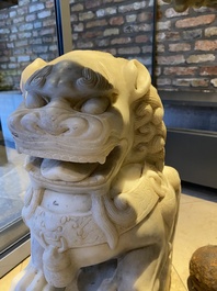 A pair of large Chinese white marble Buddhist lions, 19th C.