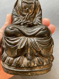 A Sino-Tibetan gilt-lacquered bronze figure of Buddha, late Ming or early Qing