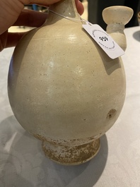 A Chinese cream-white-glazed stoneware kundika, probably Tang