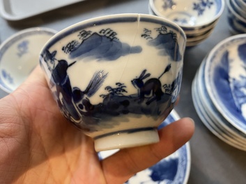 13 Chinese blue and white 'rabbit hunt' cups and 10 saucers, Qianlong mark, 19th C.