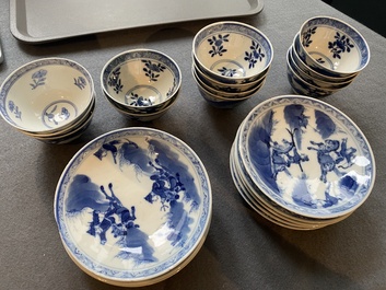 13 Chinese blue and white 'rabbit hunt' cups and 10 saucers, Qianlong mark, 19th C.