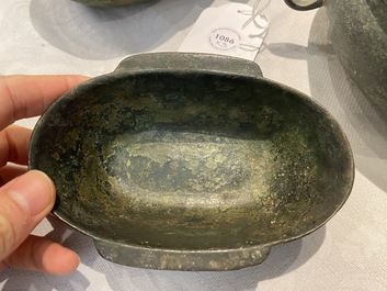 Three Chinese elliptical bronze cups, Eastern Zhou and Han