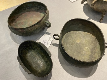 Three Chinese elliptical bronze cups, Eastern Zhou and Han