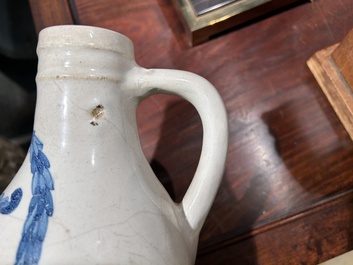 A Portuguese blue and white armorial ewer inscribed Jacob Schr&ouml;der, Lisbon, dated 1644