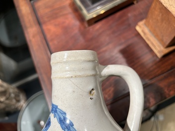 A Portuguese blue and white armorial ewer inscribed Jacob Schr&ouml;der, Lisbon, dated 1644