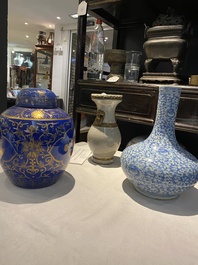 Three Chinese blue and white, crackle-glazed and powder-blue vases, 19th C.