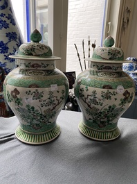 A pair of Chinese verte biscuit vases and covers, 19th C.