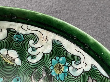 A Chinese verte biscuit 'galloping horses' bowl, Qing