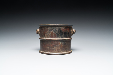 A Chinese bronze censer with mythical beast head handles, Xuande mark, Kangxi