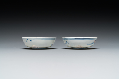 A pair of Chinese blue, white and copper-red semi-eggshell bowls, Xuande mark, Wanli