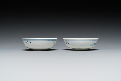 A pair of Chinese blue, white and copper-red semi-eggshell bowls, Xuande mark, Wanli