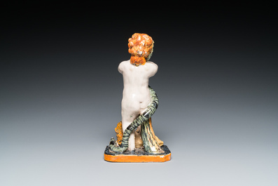 A polychrome Brussels faience sculpture of a putto with a snake standing on a lion, late 18th C.
