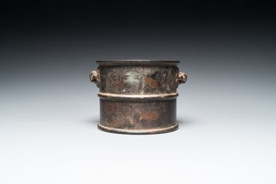 A Chinese bronze censer with mythical beast head handles, Xuande mark, Kangxi