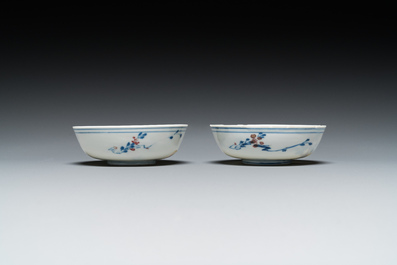 A pair of Chinese blue, white and copper-red semi-eggshell bowls, Xuande mark, Wanli