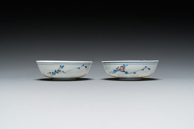 A pair of Chinese blue, white and copper-red semi-eggshell bowls, Xuande mark, Wanli