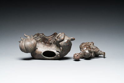 A Chinese bronze censer and cover in the shape of a Luohan on a Buddhist lion, late Ming/early Qing