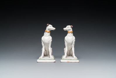 A pair of polychrome Brussels faience greyhounds, 18th C.