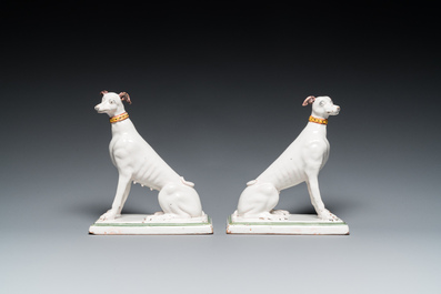 A pair of polychrome Brussels faience greyhounds, 18th C.
