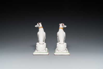 A pair of polychrome Brussels faience greyhounds, 18th C.