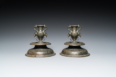 A pair of Italian engraved bronze candlesticks, probably Venice, 16th C.