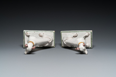 A pair of polychrome Brussels faience greyhounds, 18th C.
