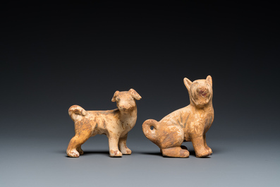 Deux mod&egrave;les de chiens en terre cuite polychrom&eacute;e de type 'mingqi', Chine, Han