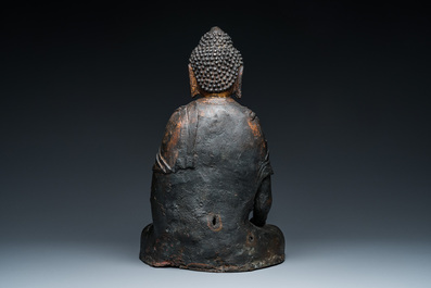 A large Sino-Tibetan bronze Buddha with traces of gilding, Ming