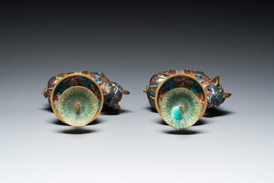 A pair of Chinese cloisonn&eacute; candlesticks in the shape of pixiu, Qing