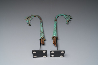 A pair of Chinese bronze finials, Warring States Period, 5th/3rd C. b.C.