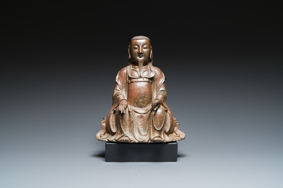 A Chinese bronze Zhen Wu with traces of red lacquer, Ming