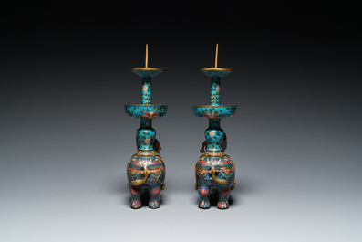 A pair of Chinese cloisonn&eacute; candlesticks in the shape of pixiu, Qing