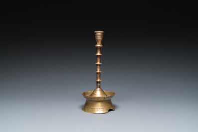 A Dutch or Flemish knotted bronze candlestick, 15/16th C.