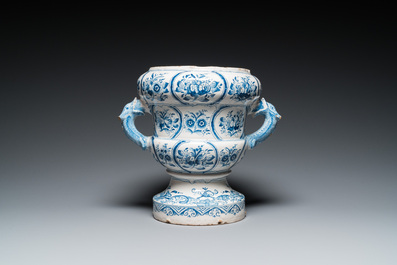 A large blue and white two-handled Frisian Delftware jardini&egrave;re with dolphin handles, Makkum, 18th C.