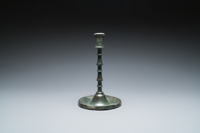 A Dutch or Flemish knotted bronze candlestick, 15th C.