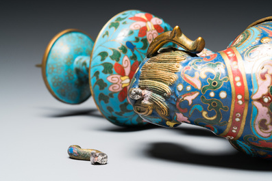 A pair of Chinese cloisonn&eacute; candlesticks in the shape of pixiu, Qing