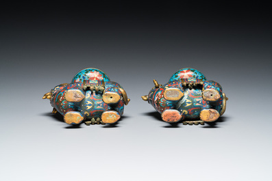 A pair of Chinese cloisonn&eacute; candlesticks in the shape of pixiu, Qing