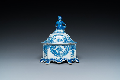 A Dutch Delft blue and white tobacco box with a nobleman holding a roll of tobacco, 2nd half 18th C.