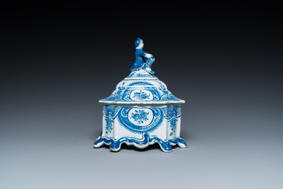 A Dutch Delft blue and white tobacco box with a nobleman holding a roll of tobacco, 2nd half 18th C.