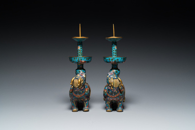 A pair of Chinese cloisonn&eacute; candlesticks in the shape of pixiu, Qing