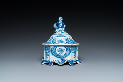 A Dutch Delft blue and white tobacco box with a nobleman holding a roll of tobacco, 2nd half 18th C.