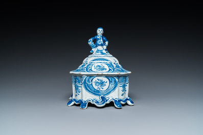 A Dutch Delft blue and white tobacco box with a nobleman holding a roll of tobacco, 2nd half 18th C.