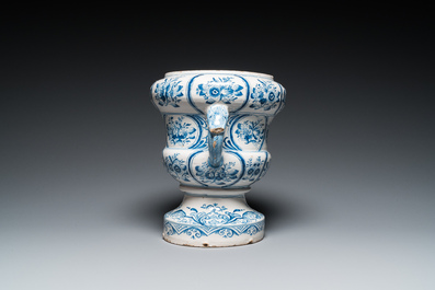 A large blue and white two-handled Frisian Delftware jardini&egrave;re with dolphin handles, Makkum, 18th C.
